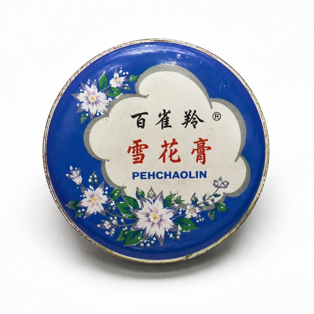 百雀羚雪花膏蓝铁盒，复古圆形印花设计，怀旧写实风格