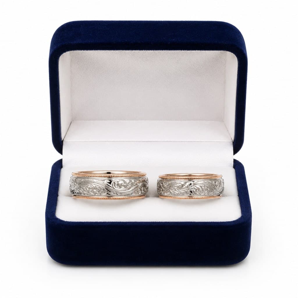 pair of engraved wedding rings in velvet box